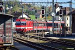 AB 11 leads a passenger train to the station